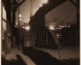 2335 Karl Struss (1886-1981) "Brooklyn Bridge from Ferry Slip, Evening," 1912, from "Karl Struss: A Portfolio," 1909-29 Platinum print on paper hinged to an embossed board mount, as issued Edition: 65/75 (there were also 15 artist's proofs), printed in 1979 Signed in pencil on the verso: Karl Struss; numbered in pencil in another hand on the mount, directly below the image, at left; Phil Davis, prtr.; Photofolio of Ann Arbor, MI, pub. Image/Sheet: 4.5" H x 3.75" W; Board Mount: 12" H x 9" W Estimate: $200 - $300