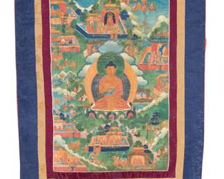 2044 A Tibetan thangka 19th/20th century, Tibet or greater Vajrayana Diaspora Painted panel depicting scenes from the life of the Buddha in multicolored pigment on cotton, bordered by silk brocade fabrics in navy, burgundy and gold, the panel unlined, with coating verso, and the borders with a red cotton lining, and with red silk ties Image: 30.75" H x 20" W; Overall: 56.5" H x 36" W Estimate: $400 - $600