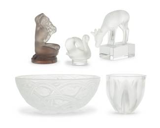 2009 Five Lalique glass table items Late 20th/early 21st century Each etched to underside: Lalique ® France Comprising a 'Deux Tulipes' bowl, a 'Daim' paperweight, a swan paperweight, a tinted 'Floreal' figural paperweight, and a 'Pinsons' bowl 5 pieces Pinsons: 3.75" H x 9.375" Dia.; Swan: 1.625" H x 2" W x 1.5" D Estimate: $400 - $600