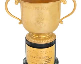 2003 A Tiffany & Co. gilt sterling silver trophy Late 20th century With factory marks and numbered: 79992; with commemoration: San Felipe Handicap / Santa Anita Park; the base inscribed to metal plaque: March 28, 1981 / One Mile and One-Sixteenth / Won By / Stancharry / Cole, Freeman & Gold, Owner / Melvin F. Stute, Trainer / Fernando Toro, Jockey / Time 1:42 Raised on a green marble base Trophy: 6.625" H x 10.375" W x 6.375" D; Base: 5.5" H x 5.625" Dia. 34.6 oz. troy Estimate: $600 - $900