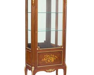 2077 A Louis XVI style kingwood vitrine Mid/late 20th century Surmounted by a marble top with glazed panel front and sides, the door with marquetry panel, with two glass shelves 63" H x 27.5" W x 15.5" D Estimate: $300 - $500