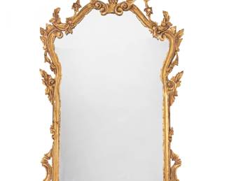 2090 A Rococo style giltwood mirror 19th century Mounted with foliate and floral motifs Overall: 49.75" H x 29.5" W x 6" D Estimate: $300 - $500