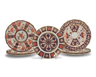 2046 A group of seven Royal Crown Derby Imari style porcelain salad plates 20th century Each with red factory marks; Old Imari with date mark for 1973 and pattern number 1128; Traditional with pattern number 2451; Chatsworth with pattern number 2646; six impressed: DERBY Comprising one 'Old Imari,' three 'Traditional Imari,' and three 'Chatsworth Imari' 7 pieces Each: 9" Dia. approximately Estimate: $100 - $200