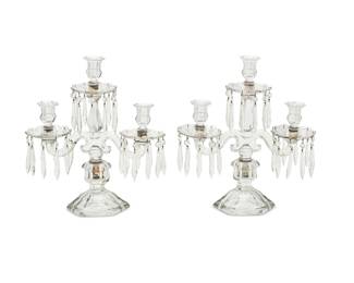 2016 A pair of Heisey molded glass 'Old Williamsburg' candelabra 20th century Each unmarked The drip pans hung with facet cut prisms 2 pieces Each: 15.5" H x 16" W Estimate: $300 - $500