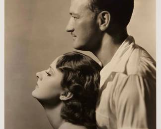 2359 George Hurrell (1904-1992) A Portrait of Helene and McClelland Barclay Photograph on paper From the edition of unknown size and date Stamped in purple ink verso: "Please Credit Hurrell / M.G.M" with a typed note affixed below the stamp Image: 9.25" H x 7.25" W; Sight: 9.75" H x 7.75" W Estimate: $200 - $300