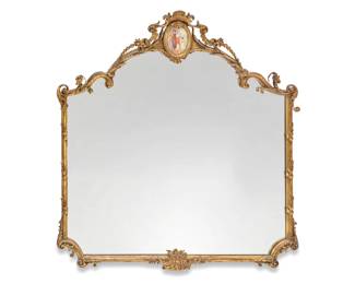 2092 A Rococo style giltwood mirror 19th/20th century The crest centered by a painted ceramic panel depicting three maidens Overall: 42.25" H x 39.5" W x 4" D Estimate: $200 - $400