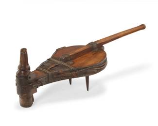 2121 A blacksmith bellows 19th/20th century Wrought-iron, leather, and carved wood with metal tacking 14.5" H x 45.5" W x 16" D Estimate: $200 - $300