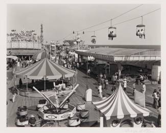 2377 George A. Tice (1938-2025) "Amusement Pier, Seaside Heights, New Jersey" 1972 Gelatin silver print on paper From the edition of unknown size, printed 1997 Signed in pencil on the mount, just below the image: George A. Tice; titled and dated in pencil on paper affix to the frame's backing paper Image/Sheet: 7.5" H x 9.5" W Estimate: $400 - $600