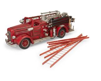 2101 A vintage hook and ladder fire truck toy Early/mid-20th century Marked: Lake Mohegan Fire District Engine No. 1 / L.M.F.D. The red painted wood and metal toy with mounted ladders, spotlights, ropes, hoses, and other accessories, together with four additional associated ladders Truck: 7.5" H x 22.75" W x 7.25" D; Longest ladder: 23" L Estimate: $300 - $500