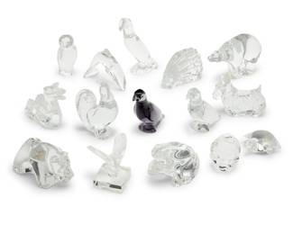 2019 A large group of Baccarat glass animals Late 20th/early 21st century Each with etched factory mark Comprising a frog, toucan, rooster, bear, polar bear, owl, monkey, dolphin, butterfly, turtle, porcupine, dog, dragon, and two parrots 15 pieces Tallest: 6" H x 5.25" W x 2.5" D; Shortest: 1.375" H x 3.125" W x 2.625" D Estimate: $300 - $500