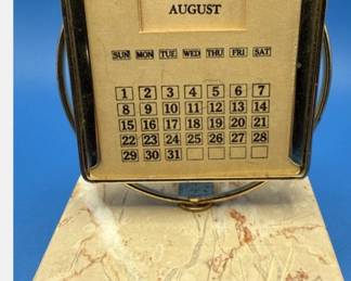 MCM office desk Perpetual Calendar. https://modestlambestatesales.hibid.com/