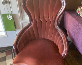 Beautiful Victorian style chair with carved rose detail, button tufted velvet fabric and cabriole legs