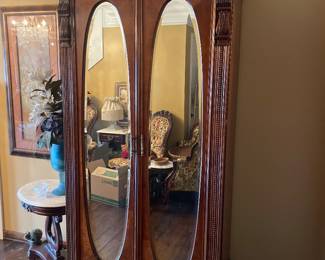 Pulaski armoire with double beveled mirrored doors, 3 drawer, clothing rack, detailed molding and claw feet