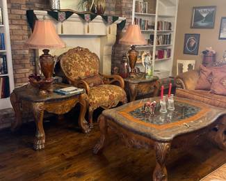 Bergere Victorian style armchair with rich floral pattern chenille fabric. Michael Amini Edon coffee table also with curved bevel glass top imperator marble inlay, carved legs and claw feet