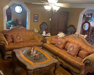 European style sofa with intricate carving, lion paw feet, rich plush floral fabric and 2 pillows