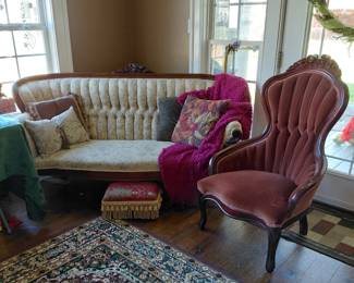 Lovely tufted floral print couch and beautiful velvet  upholstered chair with ornately carved wood
