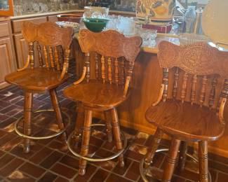 Vintage Pulaski barstools with carved oak wood design and swivel seat. Total of 6