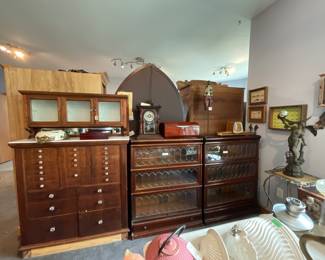 Collector’s Estate Sale featuring nautical antiques, vintage furniture, curio cabinets, library bookcases, restored cast iron cookware, antique telephones, men’s suits, garage items, eclectic home décor, and unique yard art.