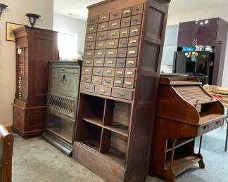 Collector’s Estate Sale featuring nautical antiques, vintage furniture, curio cabinets, library bookcases, restored cast iron cookware, antique telephones, men’s suits, garage items, eclectic home décor, and unique yard art.