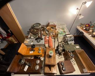 Collector’s Estate Sale featuring nautical antiques, vintage furniture, curio cabinets, library bookcases, restored cast iron cookware, antique telephones, men’s suits, garage items, eclectic home décor, and unique yard art.