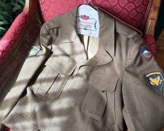vintage World War II US Army "Ike" jacket, also known as the Eisenhower jacket, which is a waist-length field uniform jacket