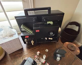 Vintage Elmo ST-800 8mm movie projector also a vintage roll up screen to go w