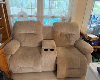 Electric reclining sofa with cup holders and remote storage console. Backs come off for easy transport.