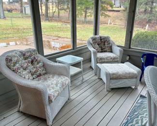 Two wicker chairs with ottoman and side table . $150 set
