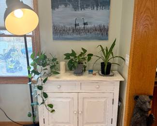 White distressed sideboard & plants