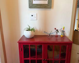 Red wooden window accent cabinet & 'Dancing Yellow Rabbit' artwork