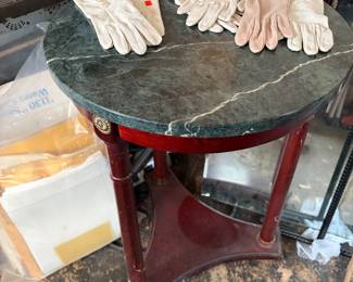 Bombay Company round side table featuring a dark green marble top and a mahogany pedestal base