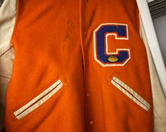 vintage Whiting varsity letterman jacket featuring an orange wool body, white leather sleeves, and a chenille "C" patcH