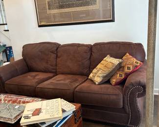 Suede like sofa.  very nice condition. modern art framed pix with horses