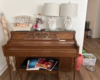 Piano, antique wax Jesus, and lamps