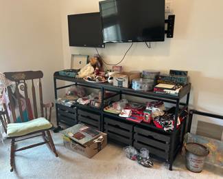 Tv console tables, tvs, vintage rocking chair, Christmas items