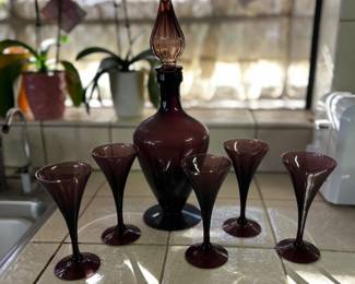 MCM Amethyst Glass Decanter set with 5 glasses. Base of this decanter has small chip