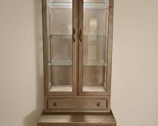 Curio Cabinet by Davis Cabinet Co., Nashville, TN-high end craftsmanship, bought at Barker Bros in the Los Angeles area. Metallic Silver Leaf finish and Hollywood Regency Style, has 2 drawers & has a light-Its Beautiful