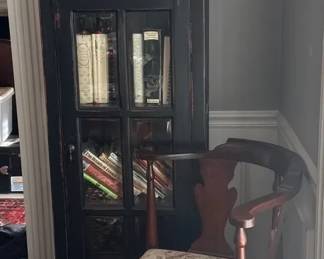 Glass Front Cabinet With Cookbooks And Corner Chair 