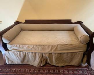 Dark Wood Framed Daybed With Skirted Base And Bolster Pillows Unknown Maker