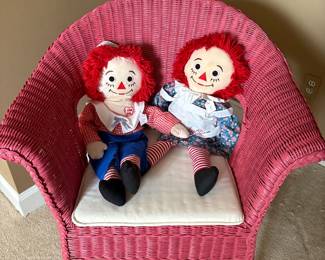 Painted wicker armchair and vintage Raggedy Ann and Andy dolls