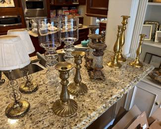 Brass, glass, and metal candle holders