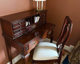 Writer's desk with side chair and brass lamp