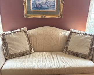 Curved-arm single cushion ivory loveseat and 2 sets of custom pillows