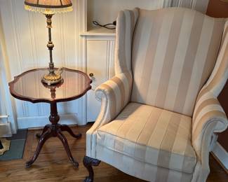 Wing-back armchair and side table with table lamp