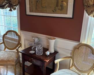 Asian screen print, two arm chairs with cane backs and upholstered seats, and Asian inspired side chest