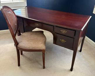 Mahogany desk with side cane-back chair
