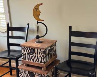  chairs, decorative boxes and a whimsical moon