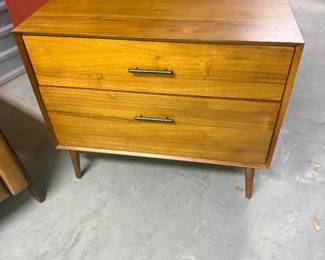 This piece is unlevel. Filing cabinet. May be as simple as a felt leg sticker on the bottom. $99