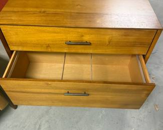 This piece is unlevel. Filing cabinet. May be as simple as a felt leg sticker on the bottom. $99