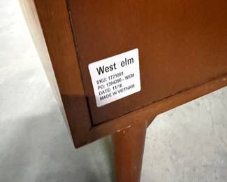 This piece is unlevel. Filing cabinet. May be as simple as a felt leg sticker on the bottom. $99